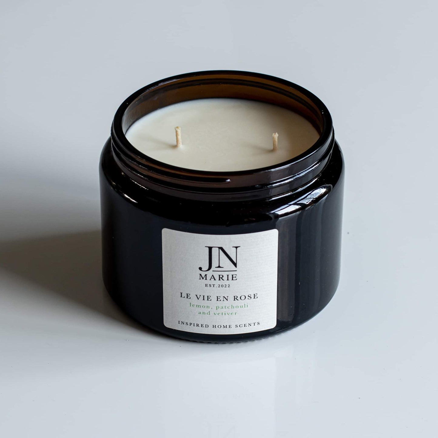 NOW WITH 25% OFF!                  Le Vie En Rose - Lemon, Patchouli & Vetiver Candle.