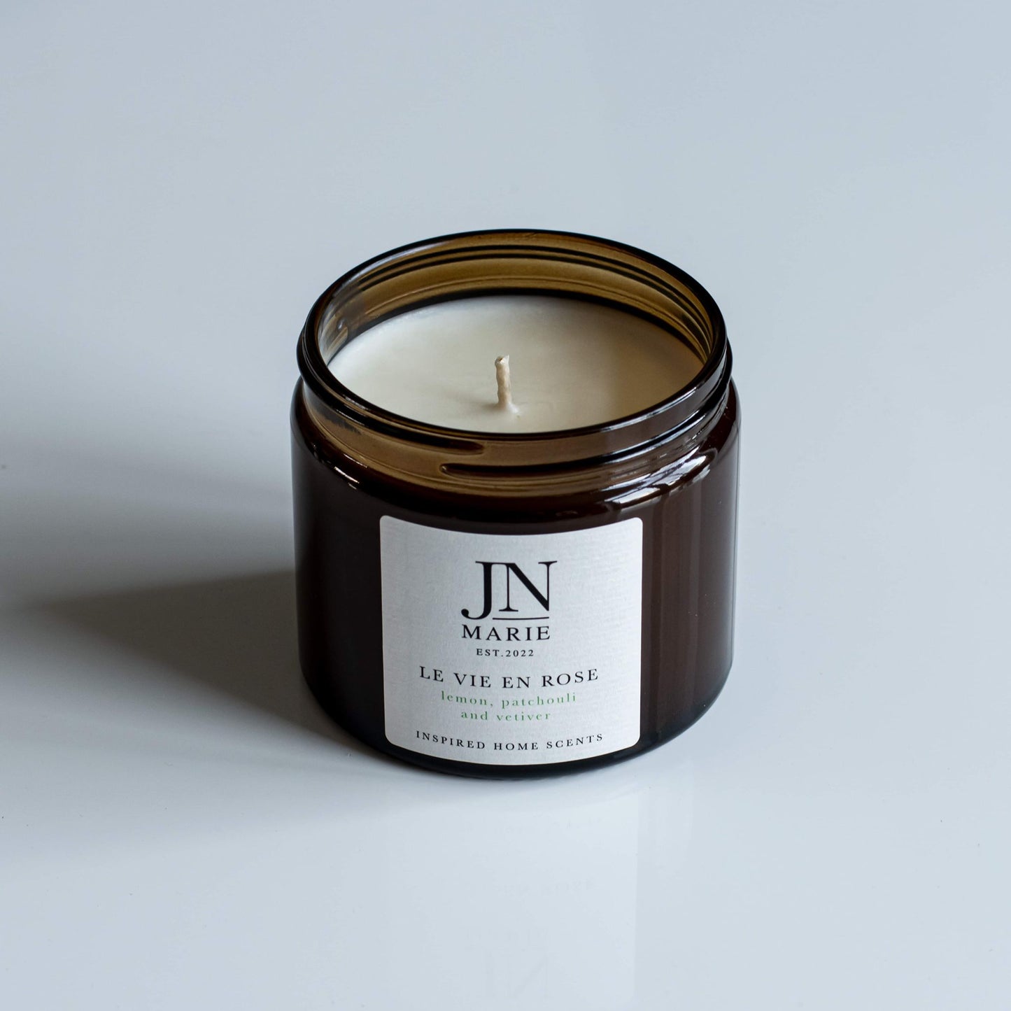 NOW WITH 25% OFF!                  Le Vie En Rose - Lemon, Patchouli & Vetiver Candle.