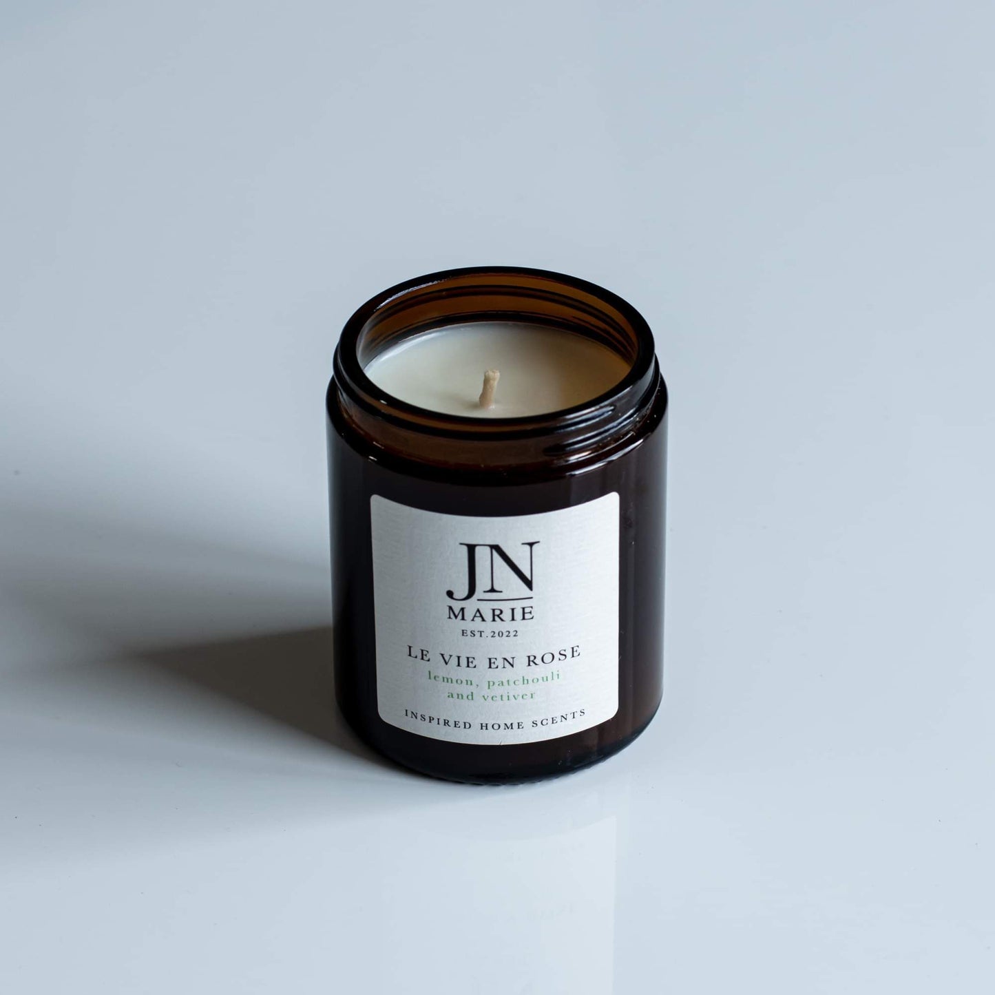 NOW WITH 25% OFF!                  Le Vie En Rose - Lemon, Patchouli & Vetiver Candle.